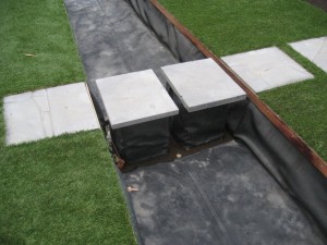 Paving laid over the formal pond